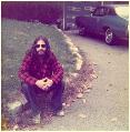 Image: Young Joe sitting on the wall retaining the lawn of the the home he grew up in.